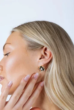 Black Flower Pearl Earrings In Gold by SVNX