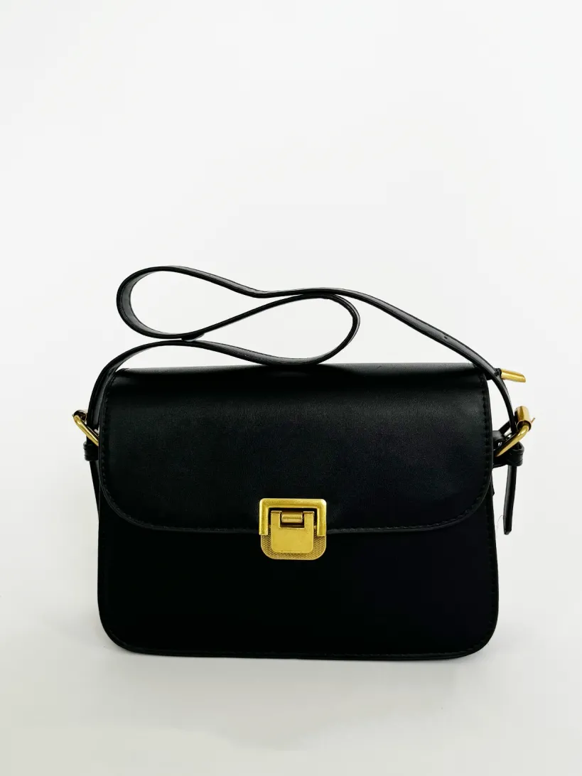 Black Shoulder Bag With Gold Clasp Fastening by SVNX
