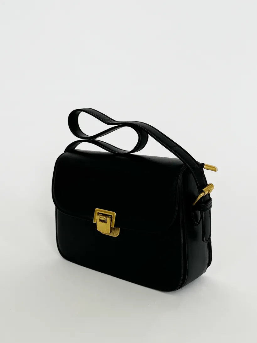 Black Shoulder Bag With Gold Clasp Fastening by SVNX