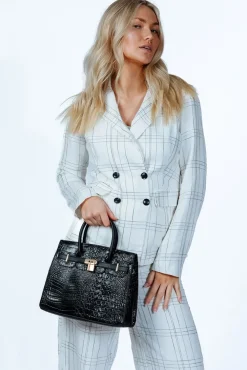 Croc Buckle Top Handle Bag In Black by SVNX