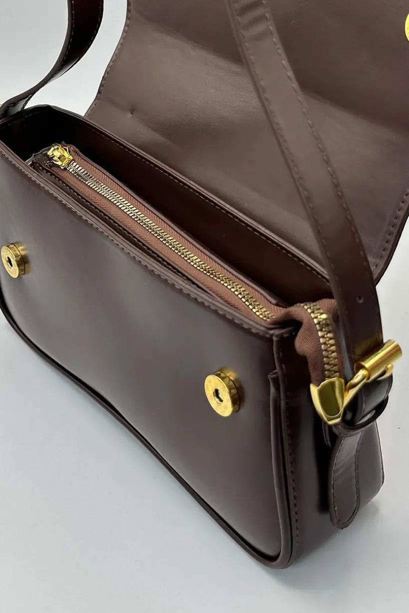 Curved Baguette Bag In Dark Brown by SVNX