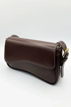Curved Baguette Bag In Dark Brown by SVNX