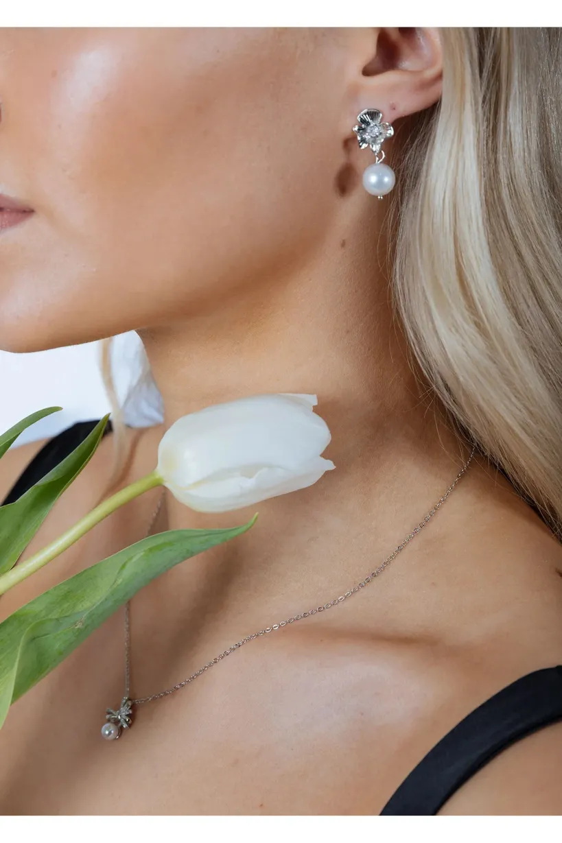 Flower Drop Pearl Earrings In Silver by SVNX