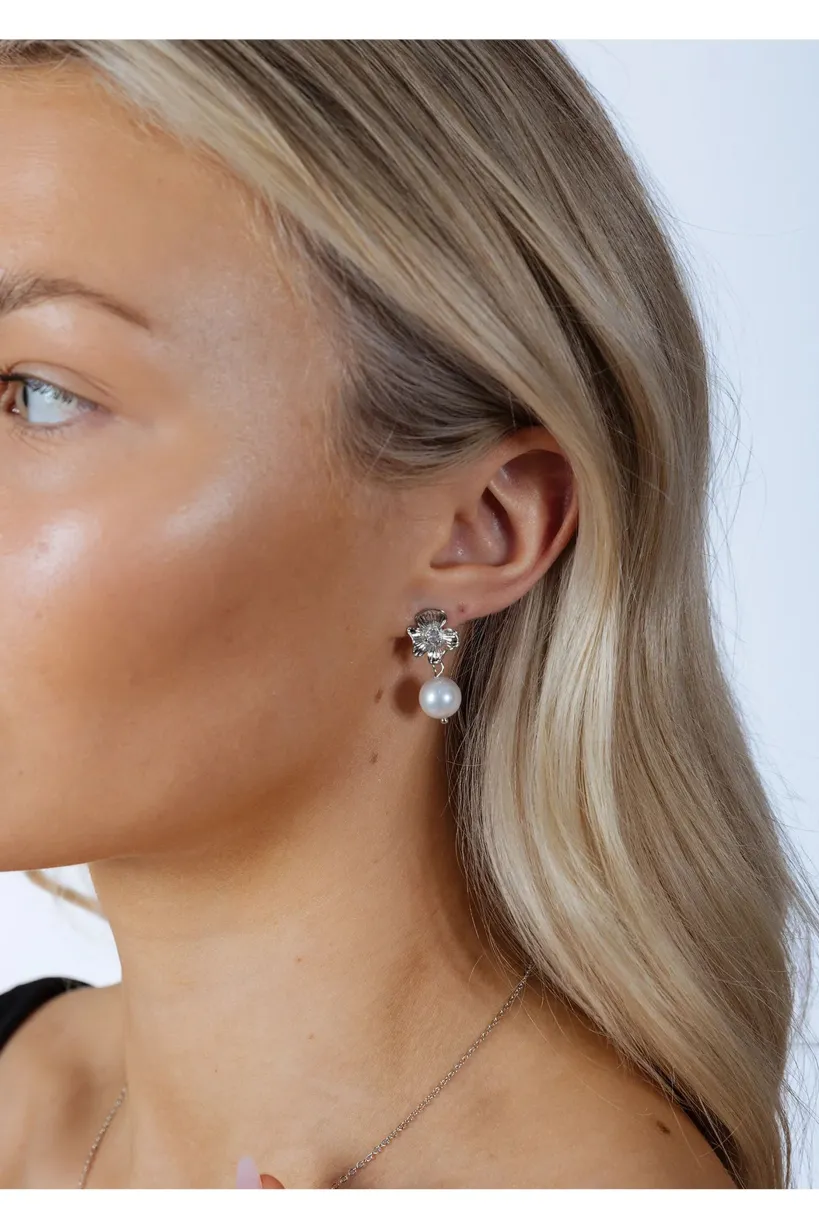 Flower Drop Pearl Earrings In Silver by SVNX