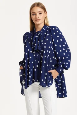 Navy Polka Dot Flared Hem Blouse by Liquorish
