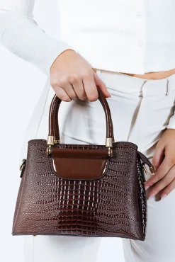 Patent Croc Top Handle Bag In Brown by SVNX