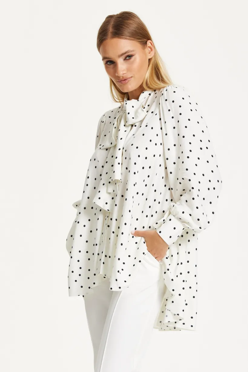 Polka Dot Ruffle High-Low Blouse by Liquorish