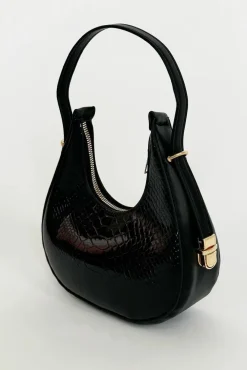 Round Shoulder Bag In Shiny Faux Croc by SVNX