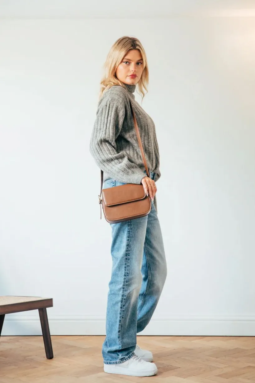 Rounded Cross Body Bag In Brown by SVNX