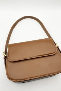 Rounded Cross Body Bag In Brown by SVNX