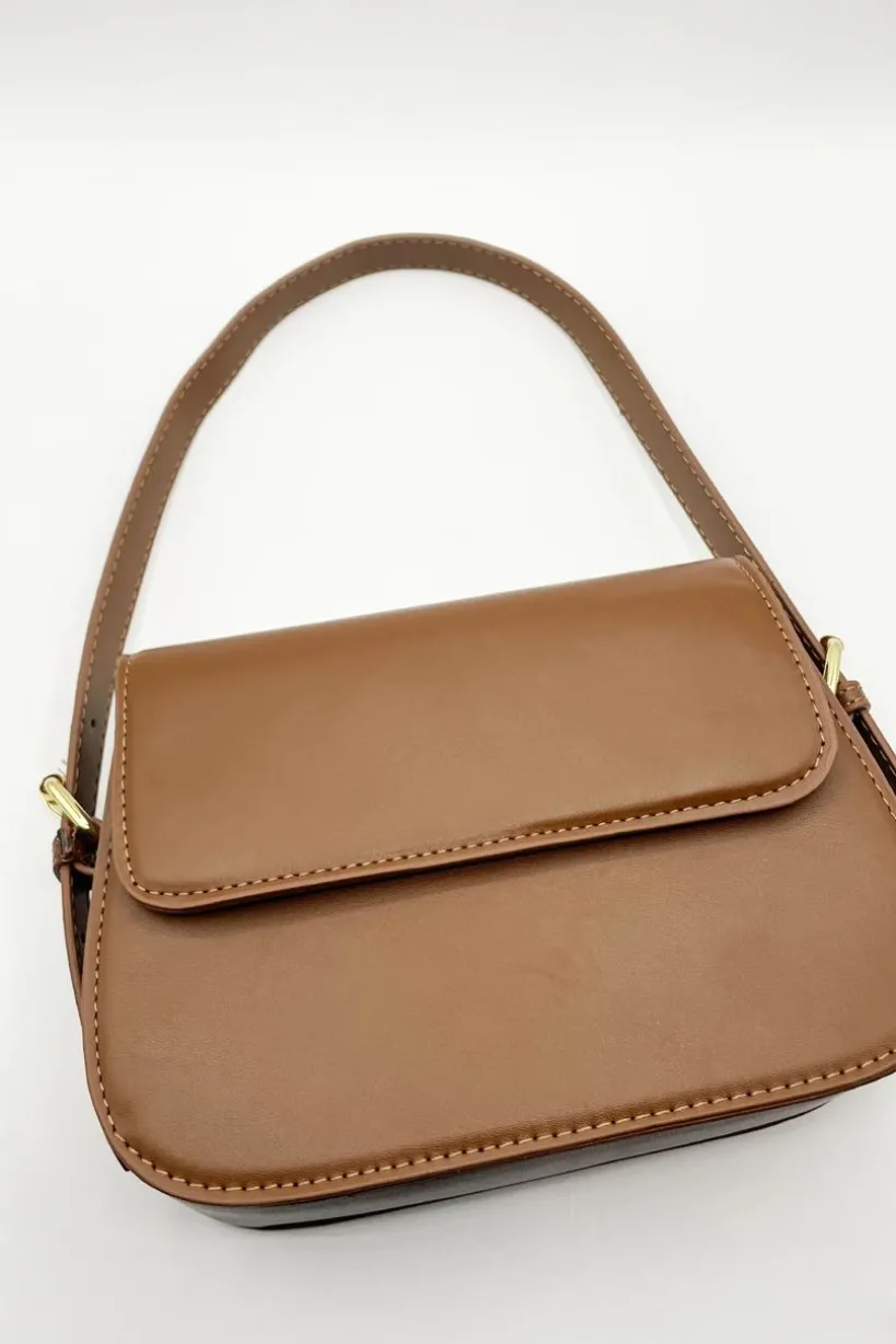 Rounded Cross Body Bag In Brown by SVNX
