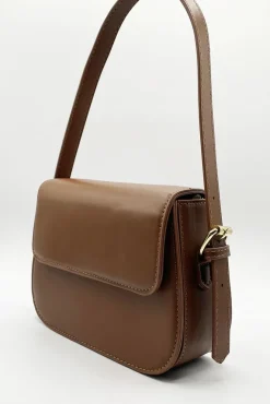 Rounded Cross Body Bag In Brown by SVNX