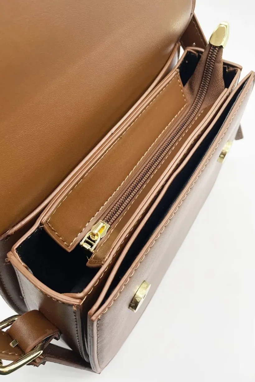 Rounded Cross Body Bag In Brown by SVNX