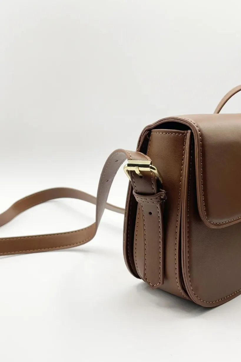 Rounded Cross Body Bag In Brown by SVNX