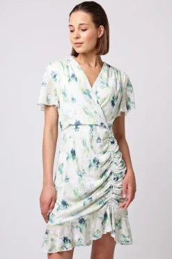 Wrap Ruched Mini Dress With Ruffle Hem In Green Floral Burnout Print by Angeleye